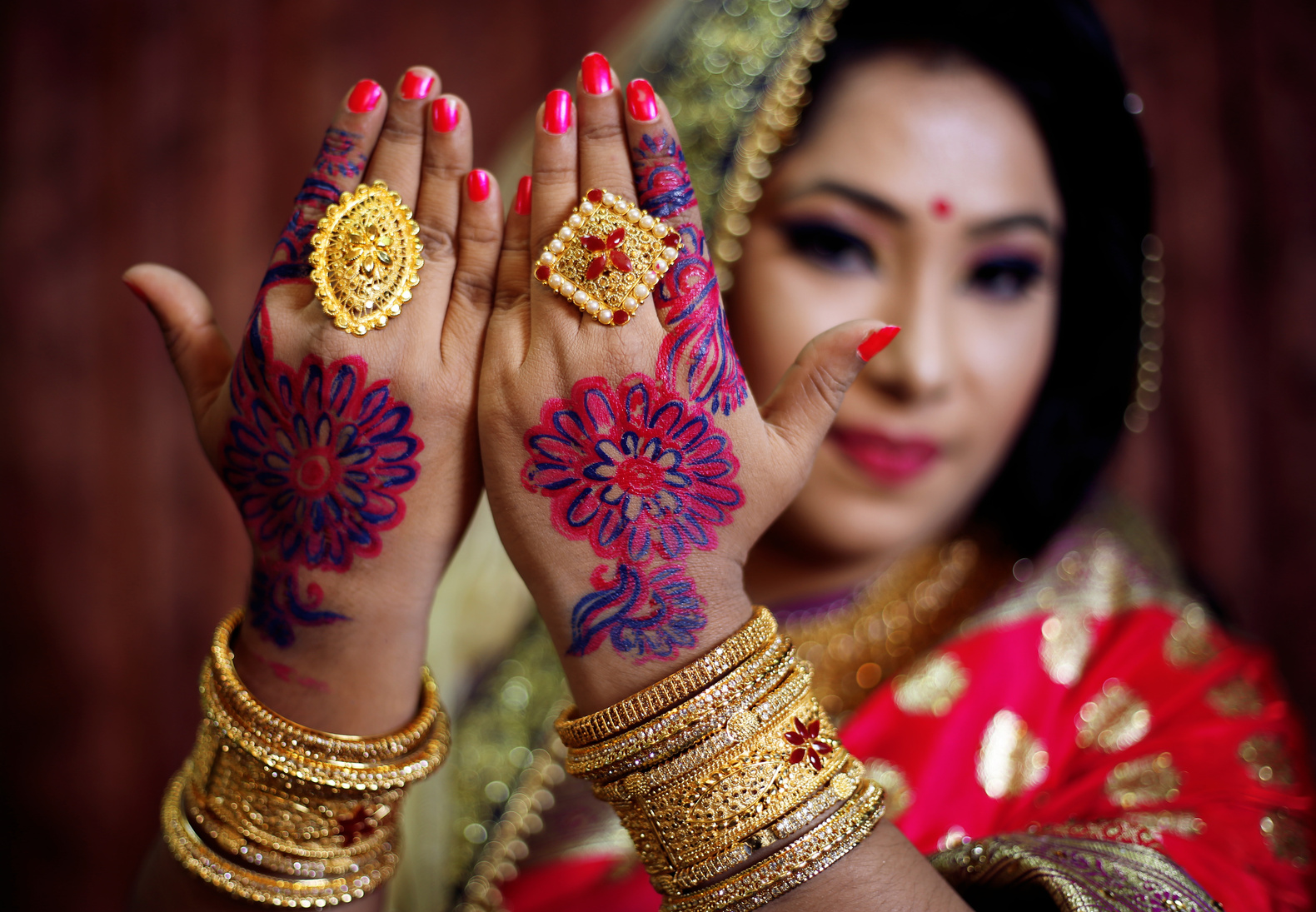 A Woman Wearing Gold Jewelries